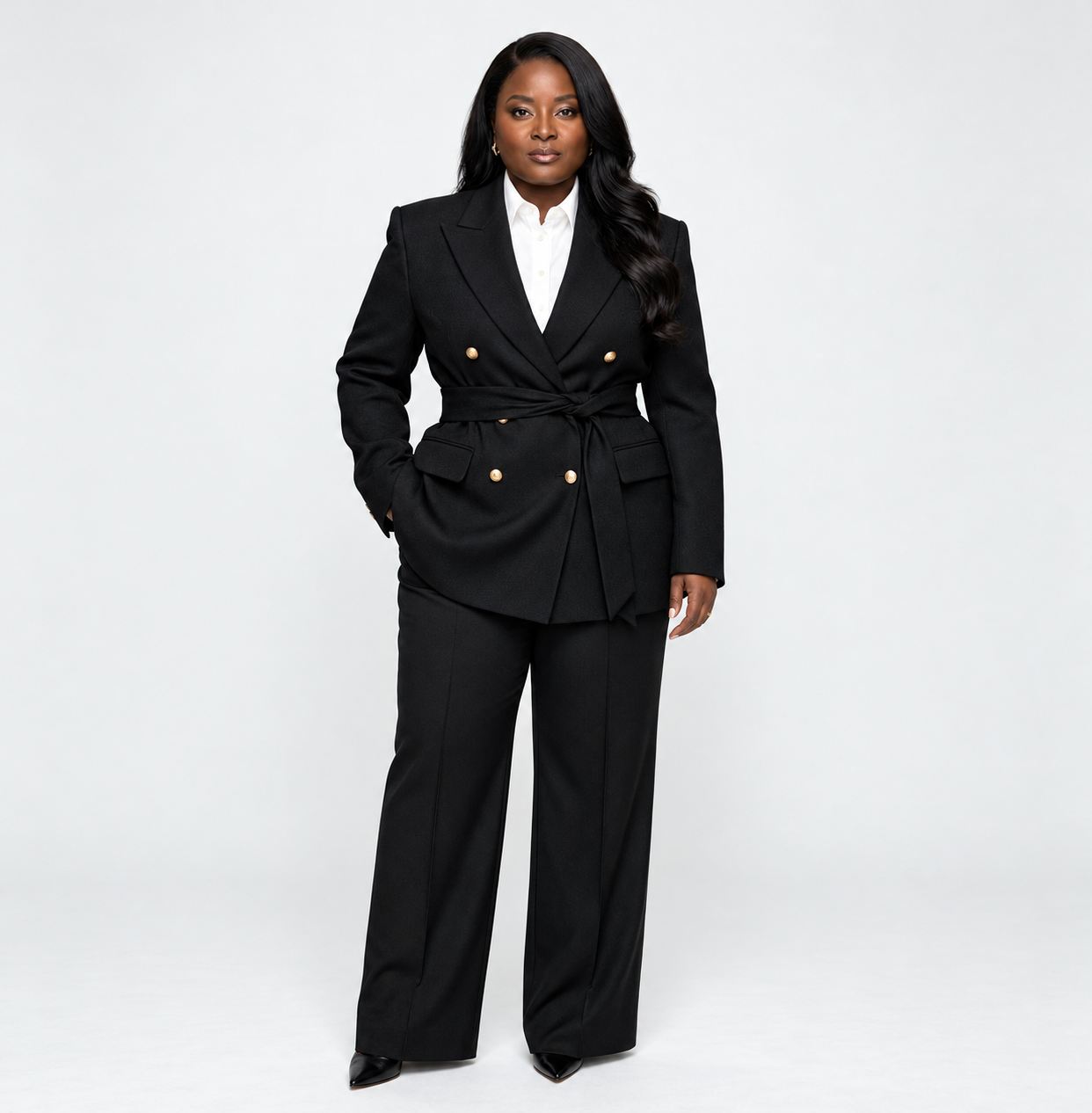 Caroline Kamga wearing a tailored black suit